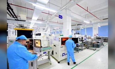 Technicians working in an LED display production and factory acceptance area