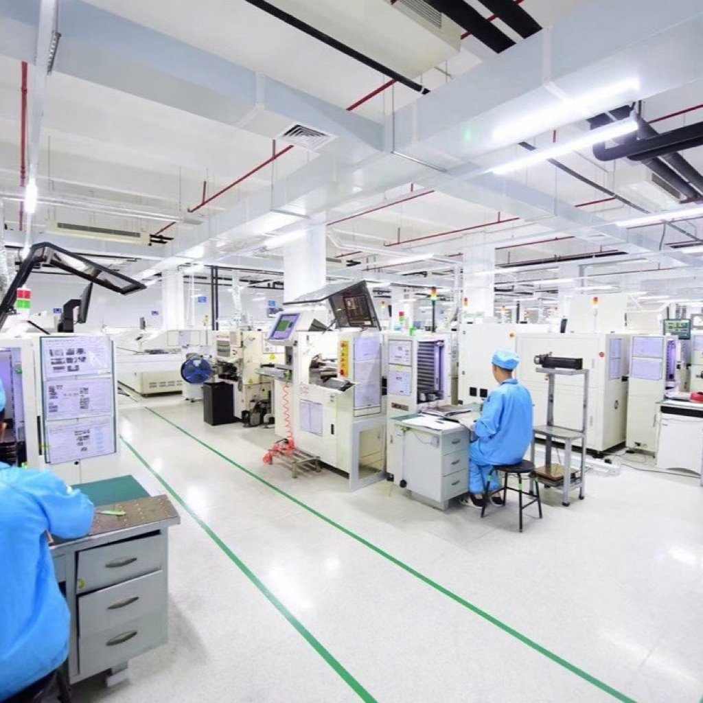 Technicians working in a clean display electronics production and inspection area